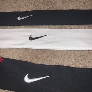 3 Nike head bands. 2 black and 1 white.